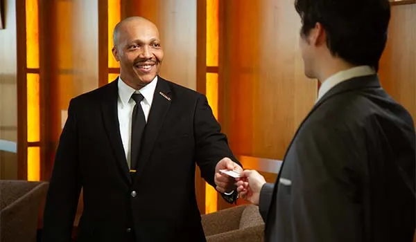 security guard checking credentials at front desk