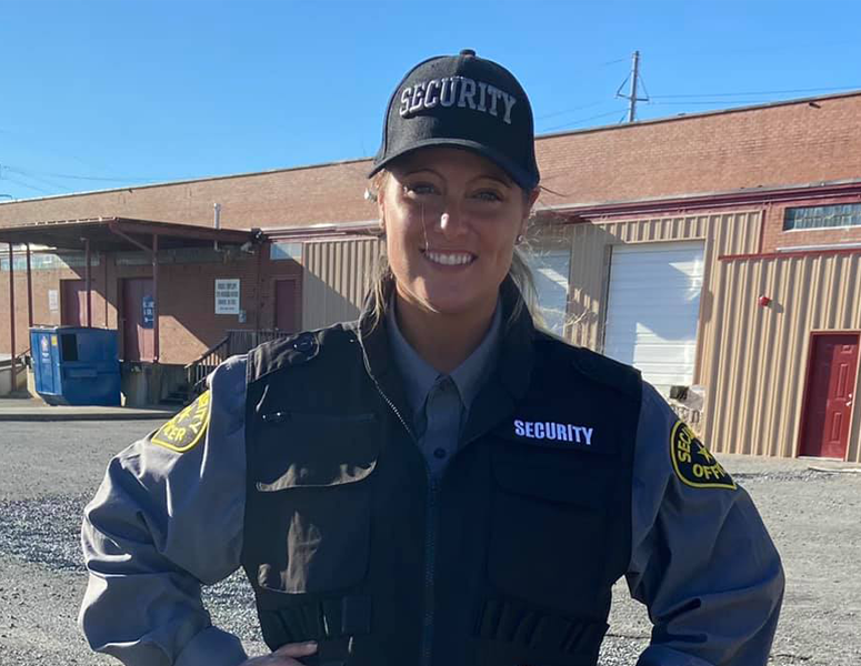 Security officer at the back of a retail store