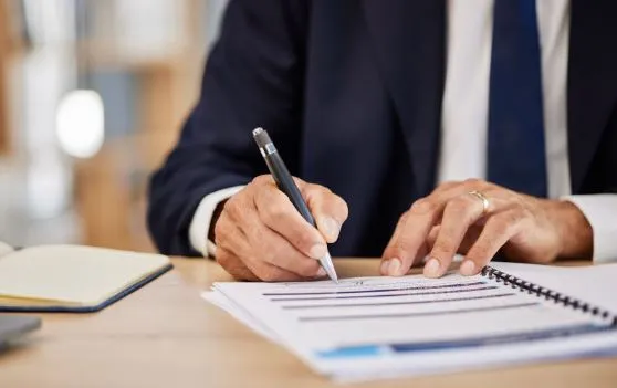 person signing paperwork