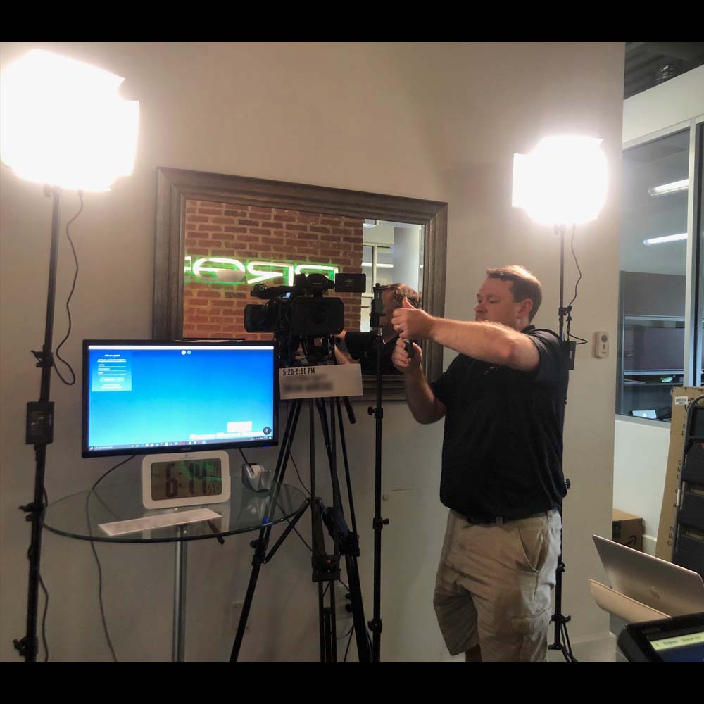 man setting up video equipment