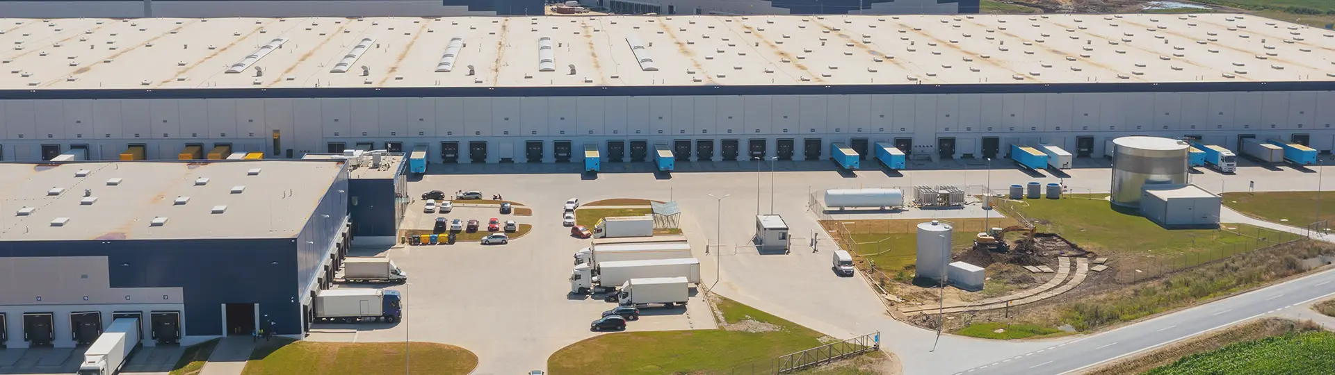 large warehouse with a security guard station at the entrance