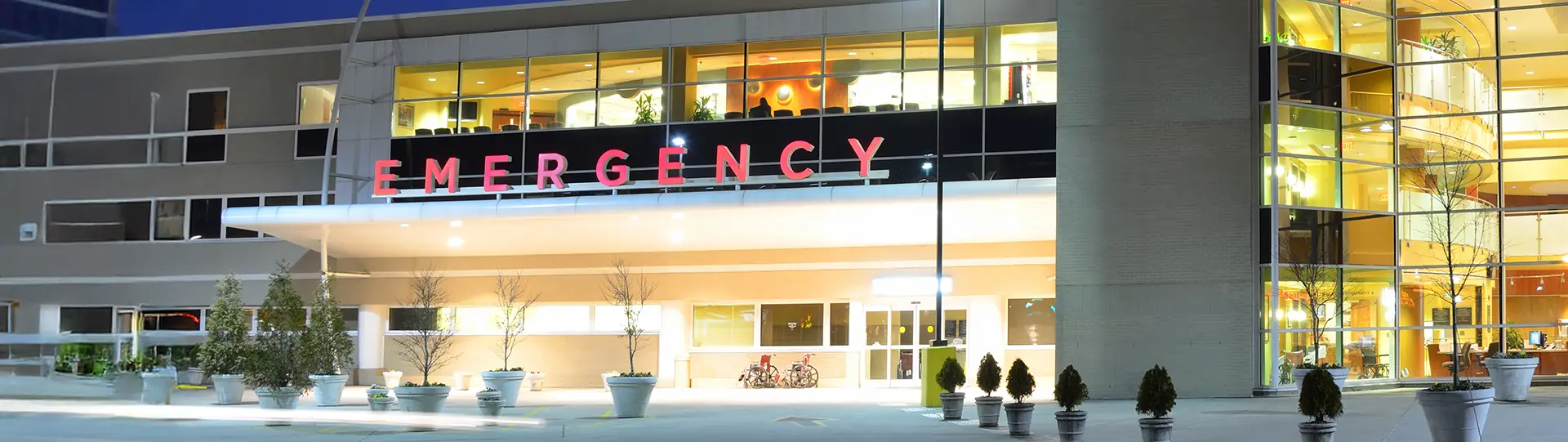 exterior of a hospital emergency entrance at night