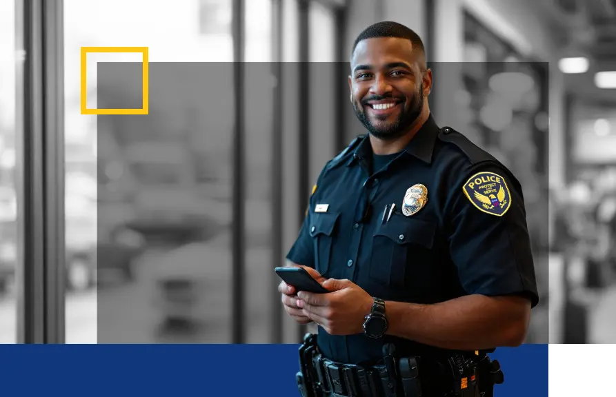 police officer smiling on cell phone