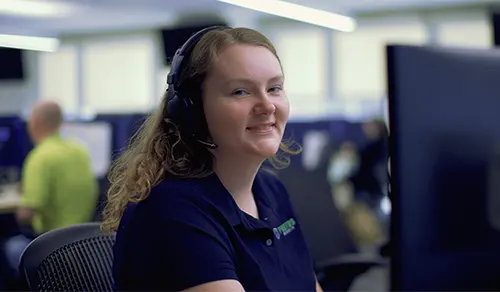 Protos Security employee working at computer