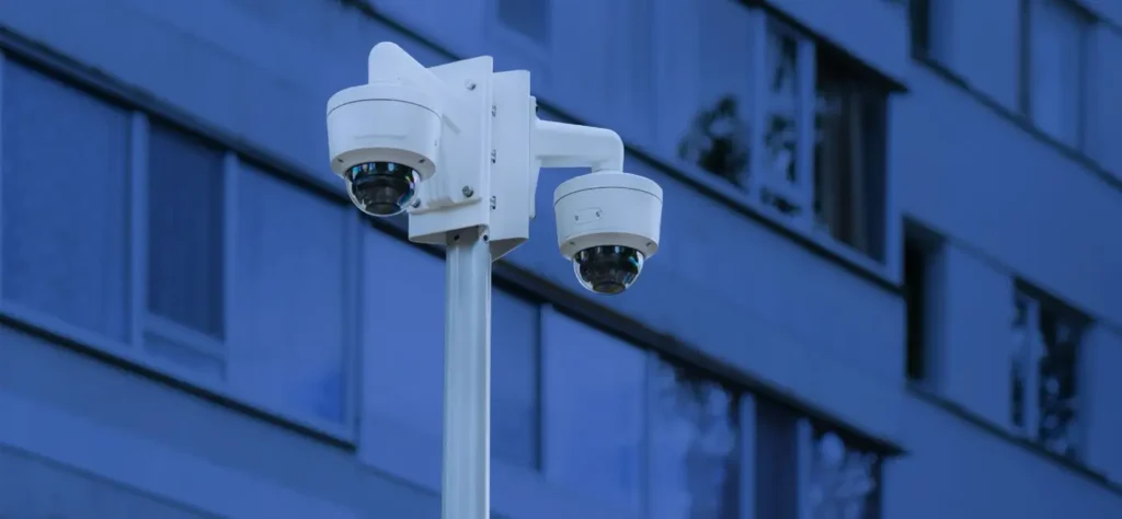 security cameras in front of a building in the evening